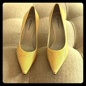 Brand-new, never worn BCBG fun yellow pumps.